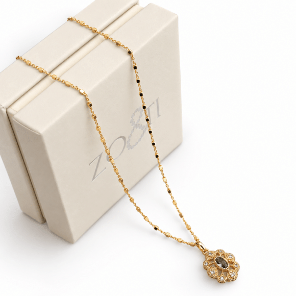 Collier avec pendentif vintage en Argent doré et plaqué-or-Ginette